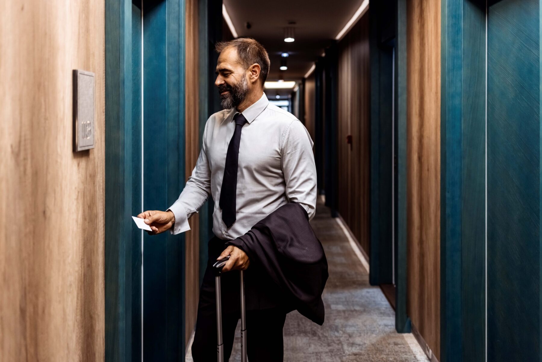 Man checking into hotel room